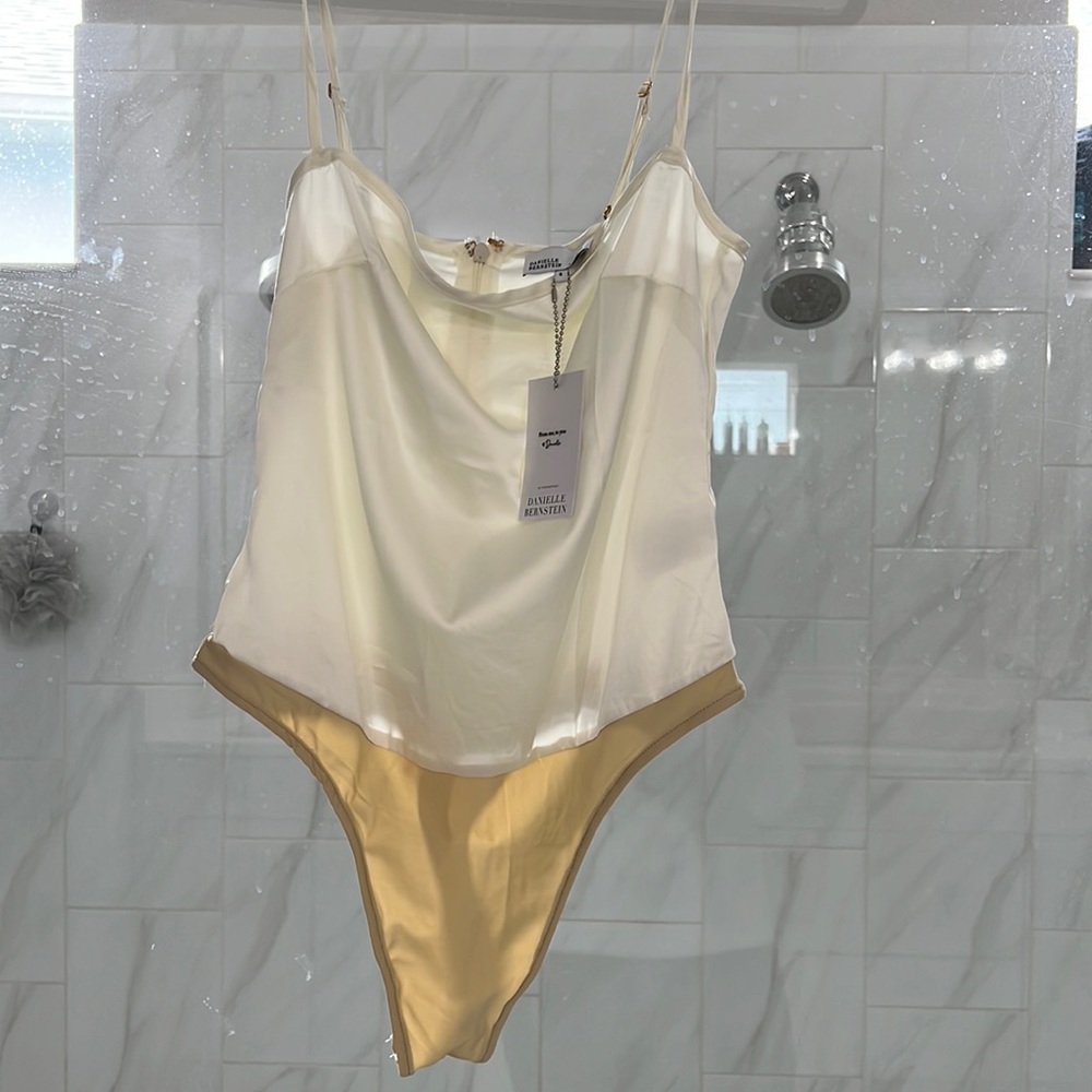 Danielle Bernstein vanilla color strappy bodysuit
